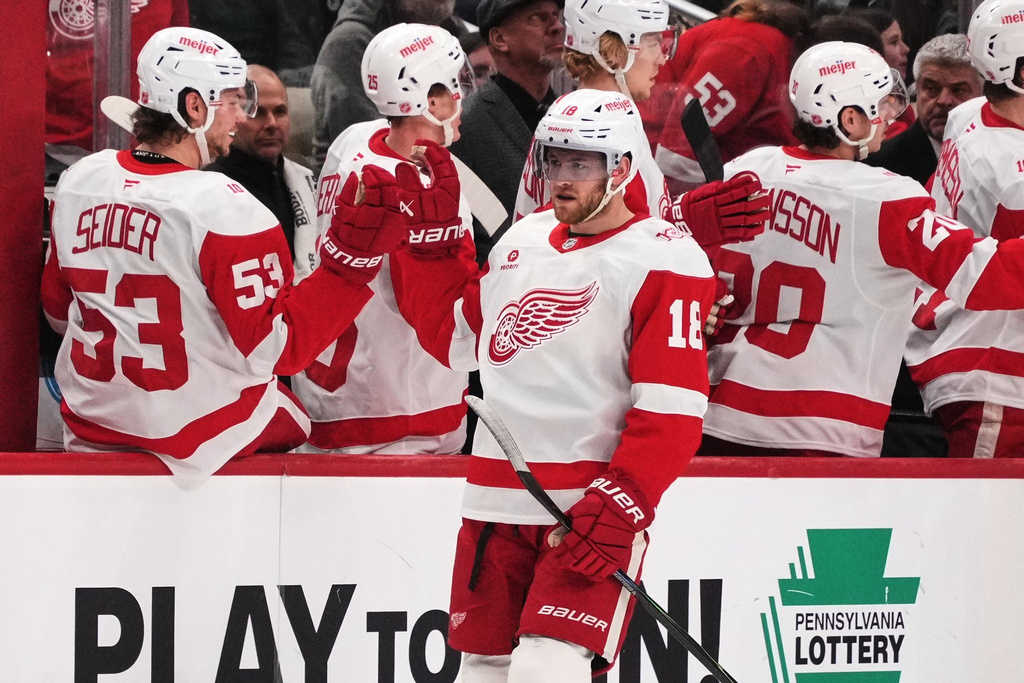 Detroit Red Wings' Andrew Copp (18) returns to the bench after scoring during the second period of an NHL hockey game against the Pittsburgh Penguins in Pittsburgh, Thursday, Jan. 1, 2026. (AP Photo/Gene J. Puskar)