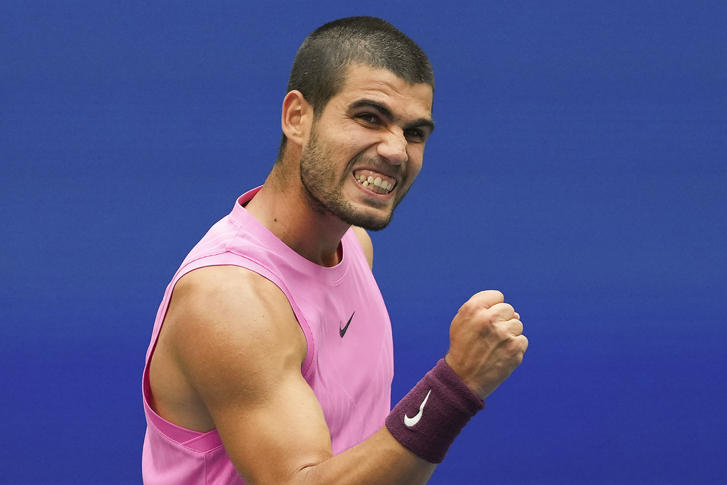 Carlos Alcaraz, of Spain, reacts after winning a game against Novak Djokovic, of Serbia, during the men's singles semifinals of the U.S. Open tennis championships, Friday, Sept. 5, 2025, in New York. (AP Photo/Kirsty Wigglesworth)
