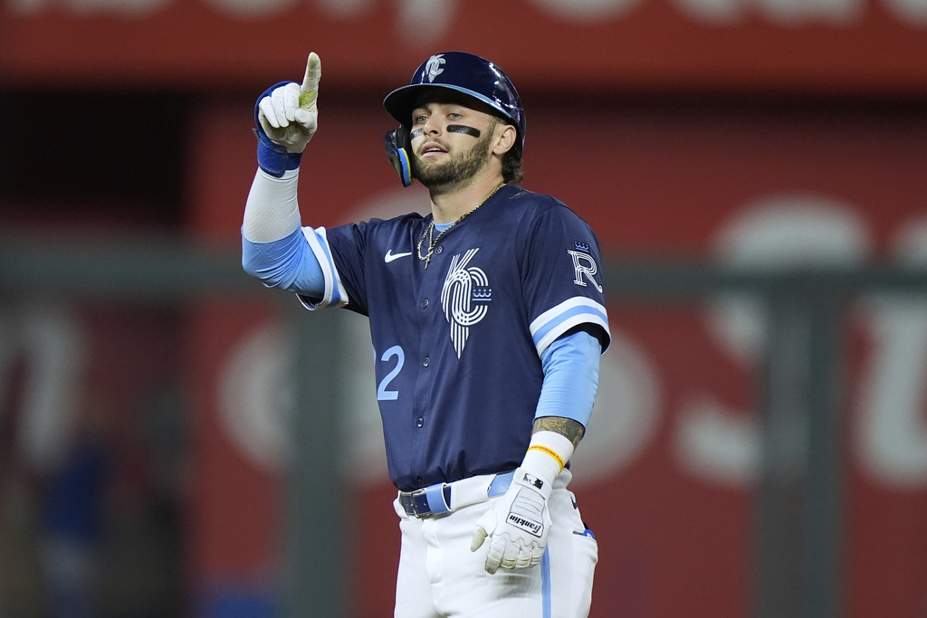 Kansas City Royals' Carter Jensen celebrates on second after hitting a two-run double during the third inning of a baseball game against the Toronto Blue Jays, Friday, Sept. 19, 2025, in Kansas City, Mo. (AP Photo/Charlie Riedel)