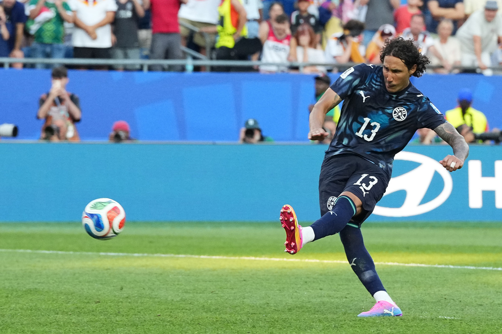 Paraguay's Jose Canale (13) scores a sudden death penalty goal to win the match during the World Cup round of 32 soccer match between Germany and Paraguay in Foxborough, Mass., near Boston, Monday, June 29, 2026. (AP Photo/Martin Meissner)