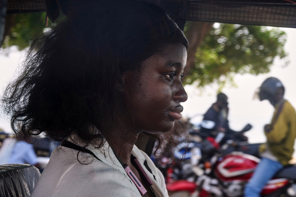 Halimatu Kamara, a rickshaw driver poses for a portrait in Freetown, Sierra Leone, March 7, 2026. (AP Photo/Abdul Hamid Kanu)