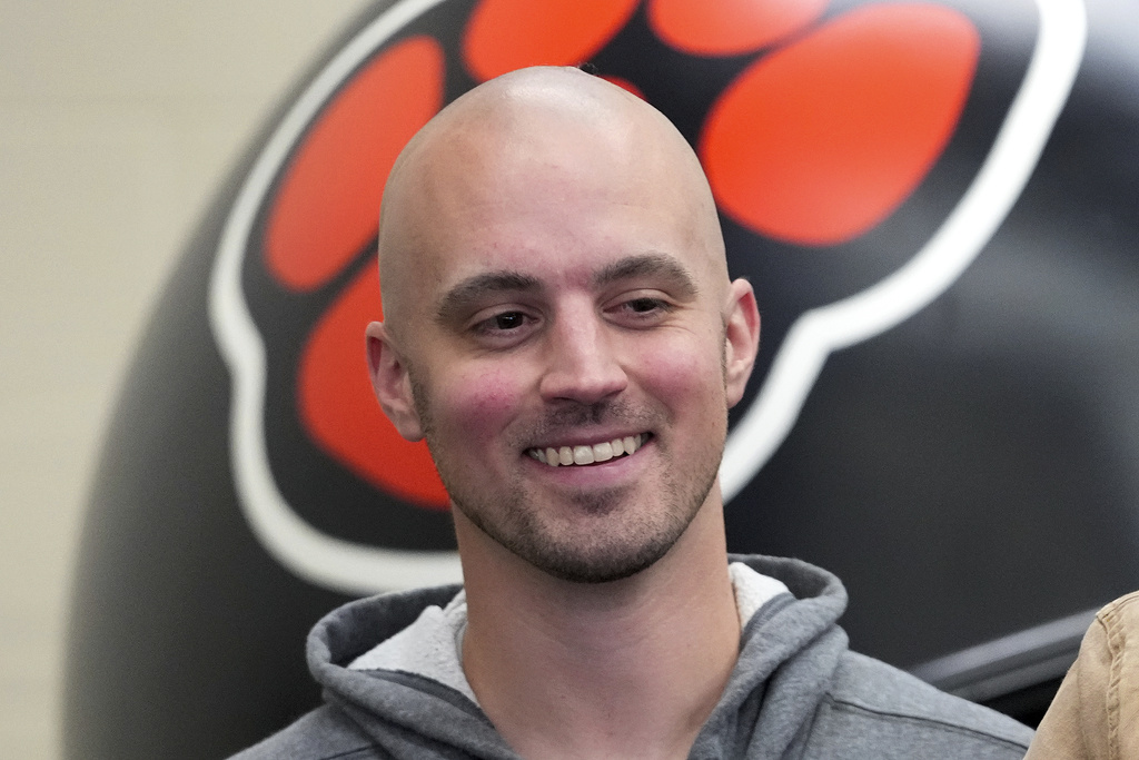 FILE - Belleville High School assistant football coach Connor Stalions smiles during a news conference in Belleville, Mich., Dec. 4, 2024. (AP Photo/Paul Sancya, file)