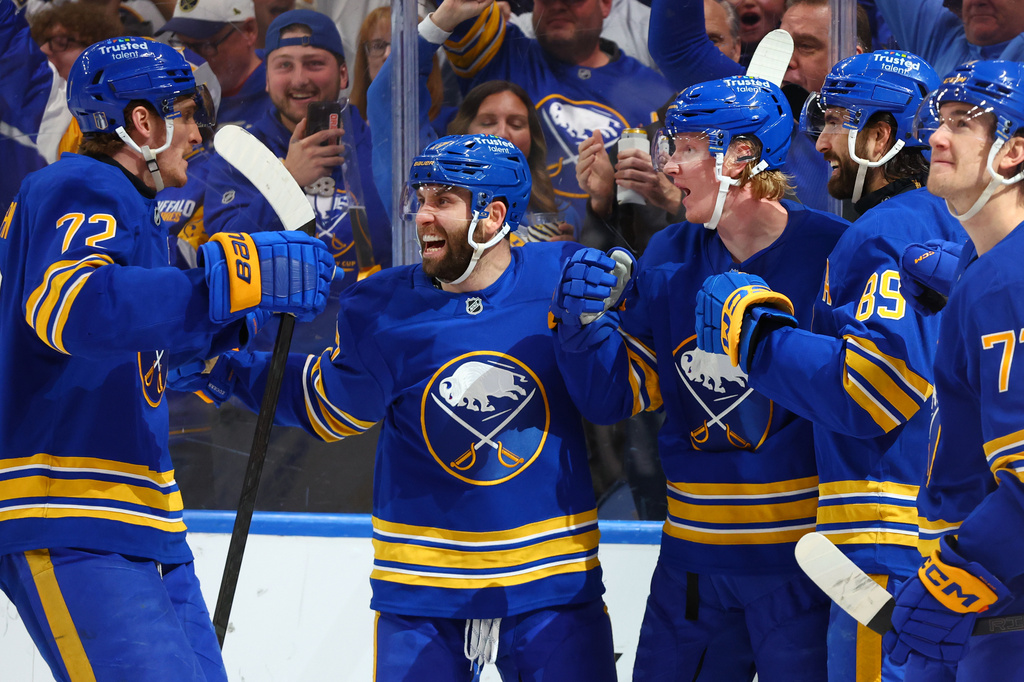 Buffalo Sabres teammates celebrate a goal by defenseman Rasmus Dahlin (26) during the first period in Game 5 of a first-round NHL hockey Stanley Cup playoff series against the Boston Bruins Tuesday, April 28, 2026, in Buffalo, N.Y. (AP Photo/Jeffrey T. Barnes)