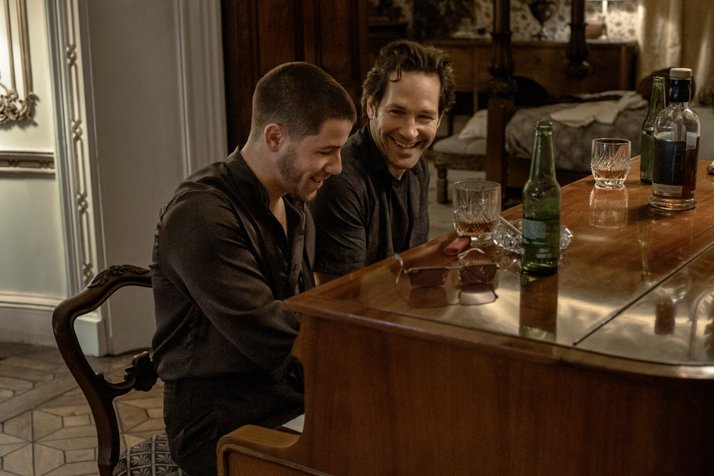 This image released by Lionsgate shows Nick Jonas, left, and Paul Rudd in a scene from "Power Ballad." (David Cleary/Lionsgate via AP)