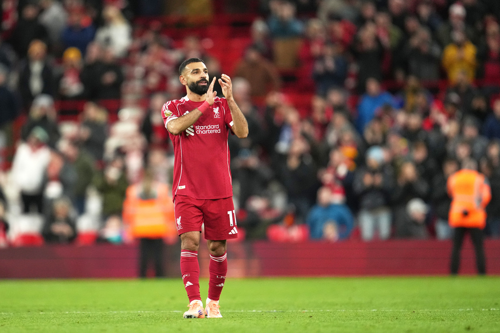 Liverpool's Mohamed Salah applauds supporters after the English Premier League soccer match between Liverpool and Brighton and Hove Albion in Liverpool, England, Saturday, Dec. 13, 2025. (AP Photo/Jon Super)
