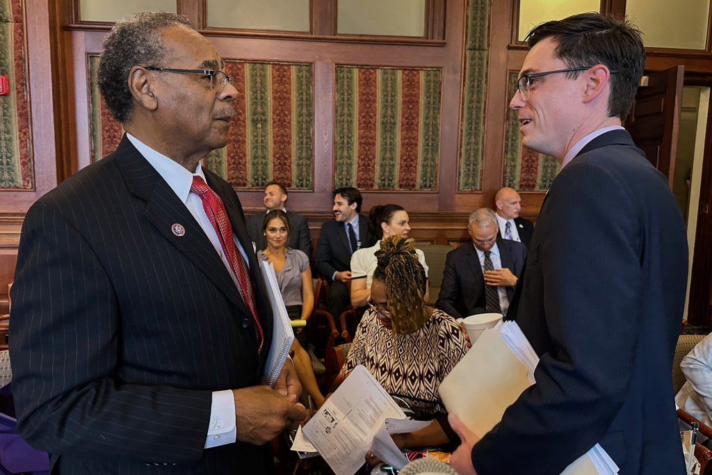 Democratic U.S. Rep. Emanuel Cleaver speaks to Missouri state Rep. Dirk Deaton, the Republican sponsor of a congressional redistricting plan, before testifying against it at a Missouri Senate hearing on Thursday, Sept. 11, 2025 in Jefferson City, Mo. (AP Photo/David A. Lieb)