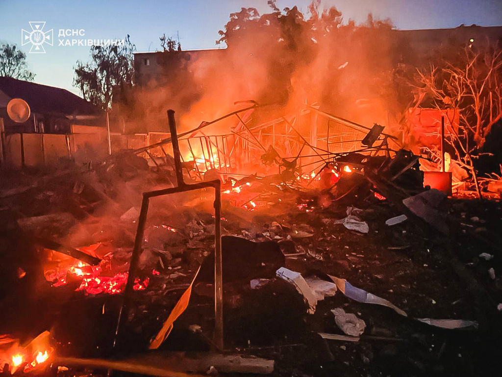 In this photo provided by the Ukrainian Emergency Services on Tuesday, June 9, 2026, a damaged building burns after a Russian strike in Kharkiv, Ukraine. (Ukrainian Emergency Service via AP)