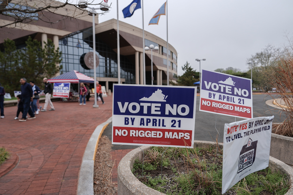 Voters walk outside the Fairfax County Government Center during early voting for the Virginia redistricting referendum, Friday, April 3, 2026, in Fairfax, Va. (AP Photo/Julia Demaree Nikhinson)