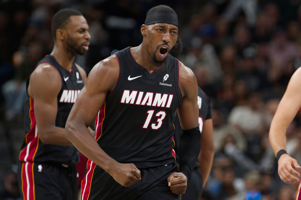 Miami Heat forward Bam Adebayo celebrates after a basket during the second half of an NBA basketball game against the San Antonio Spurs, Thursday, Oct. 30, 2025, in San Antonio. (AP Photo/Darren Abate)