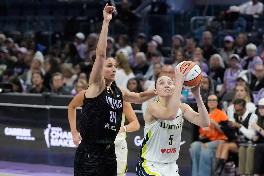Dallas Wings guard Paige Bueckers (5) shoots against Golden State Valkyries forward Cecilia Zandalasini (24) during the second half of a WNBA basketball game in San Francisco, Monday, Aug. 17, 2026. (AP Photo/Jeff Chiu)