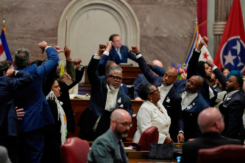 House Democrats gesture on the chamber floor as they vote against a bill to redraw U.S. Congressional voting maps during a special session of the state legislature Thursday, May 7, 2026, in Nashville, Tenn. (AP Photo/George Walker IV)
