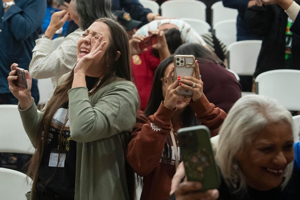 People celebrate after passage of the National Defense Authorization Act by the U.S. Senate, during a watch party hosted by the Lumbee Tribe of North Carolina, Wednesday, Dec. 17, 2025, in Pembroke, N.C. (AP Photo/Allison Joyce)
