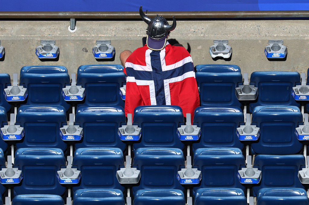 A Norway fan dons a viking helmet nd flag waiting for the start of the World Cup Group I soccer match between Iraq and Norway in Foxborough, Mass., near Boston, Tuesday, June 16, 2026. (AP Photo/Mark Stockwell)