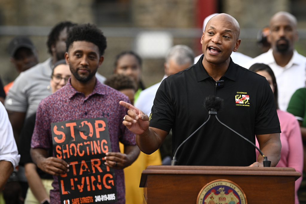 Maryland Gov. Wes Moore, right, speaks next to Baltimore mayor Brandon Scott, left, during a news conference, Friday, Sept. 5, 2025, in Baltimore. (AP Photo/Nick Wass)