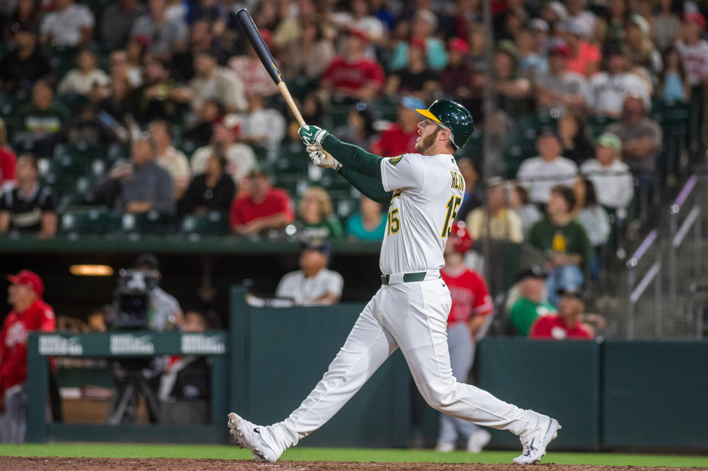 Athletics' Jonah Heim hits a home run during the ninth inning of a baseball game against the Los Angeles Angels in West Sacramento, Calif., Friday, June 19, 2026. (AP Photo/Nic Coury)