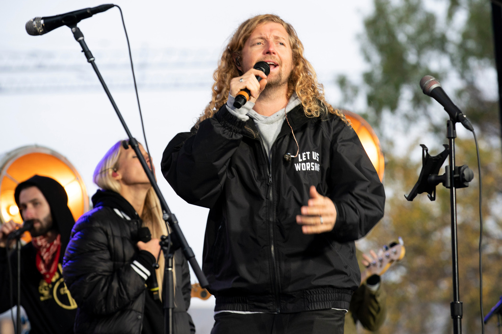 FILE - Christian musician Sean Feucht, of California, preaches to the crowd during a rally at the National Mall in Washington, Oct. 25, 2020. (AP Photo/Jose Luis Magana, File)