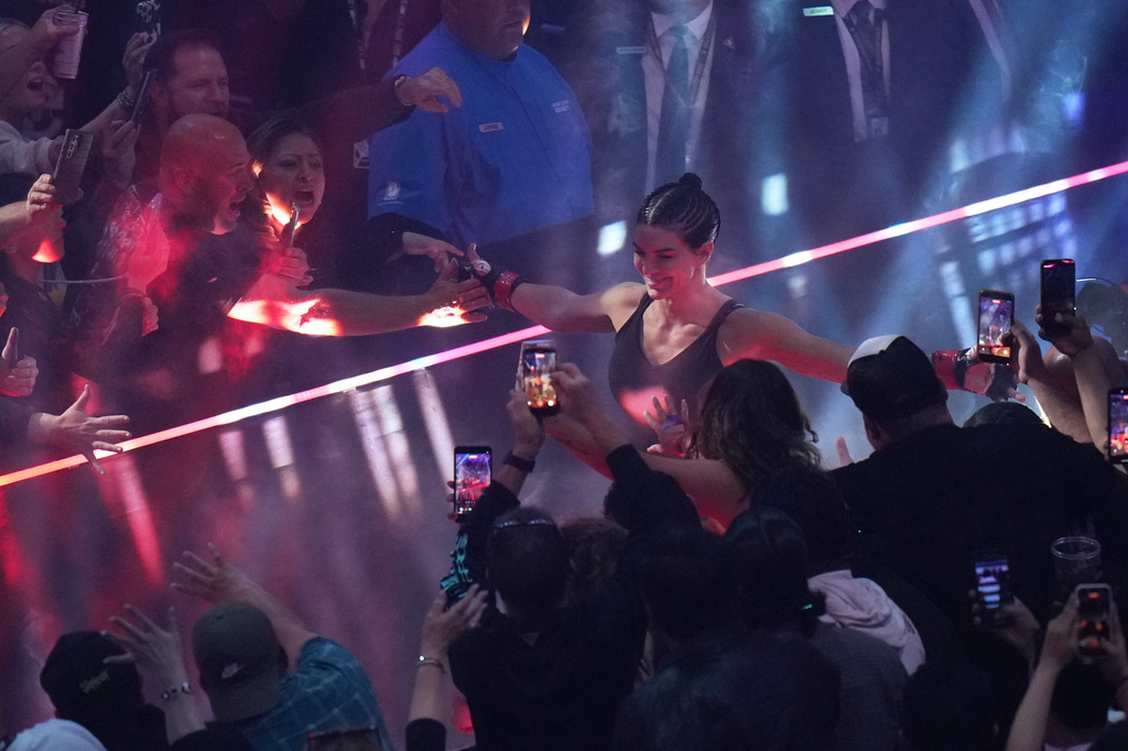 Gina Carano, of the United States, is introduced before facing Ronda Rousey, of the United States, in a featherweight mixed martial arts fight Saturday, May 16, 2026, in Inglewood, Calif. (AP Photo/Jae C. Hong )