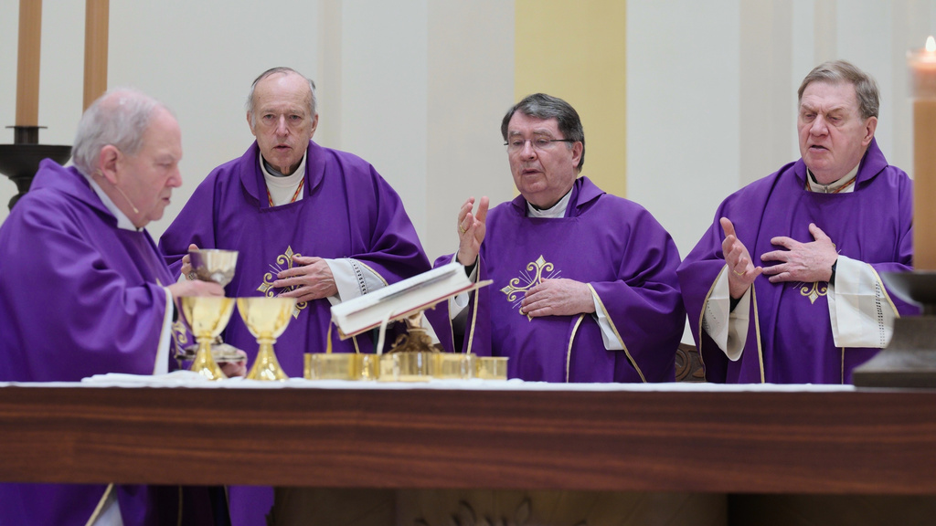 Archbishop Bernard Hebda, and Cardinals Robert McElroy, Christophe Pierre and Joseph Tobin celebrate a mass in solidarity with migrants at the Chapel of St. Thomas Aquinas on Friday, Feb. 27, 2026 in St. Paul, Minn. (AP Photo/Mark Vancleave)