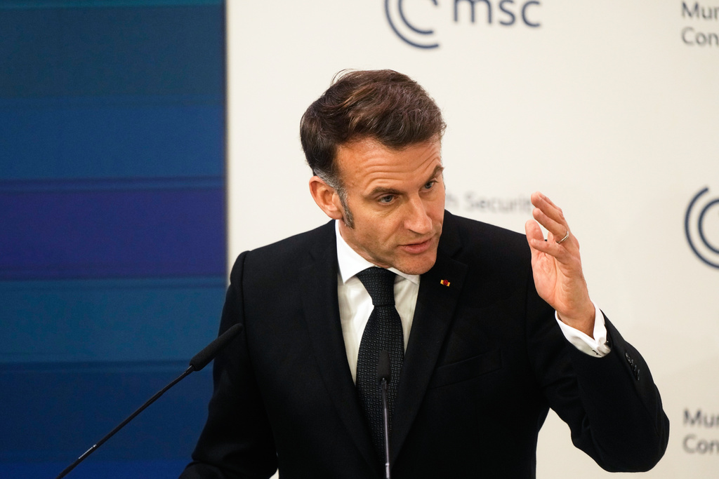 French President Emmanuel Macron addresses the audience during a session at the Munich Security Conference in Munich, Germany, Friday, Feb. 13, 2026. (AP Photo/Michael Probst)