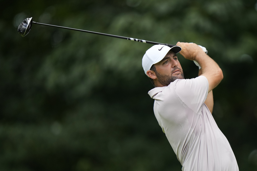 Scottie Scheffler hits from the fifth tee during the third round of the BMW Championship golf tournament Saturday, Aug. 16, 2025, in Owings Mills, Md. (AP Photo/Stephanie Scarbrough)