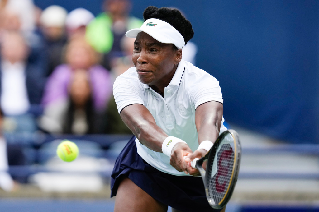 Venus Williams plays a return against Kamilla Rakhimova during the National Bank Open tennis tournament in Toronto, Sunday, Aug. 2, 2026. (Chris Young/The Canadian Press via AP)