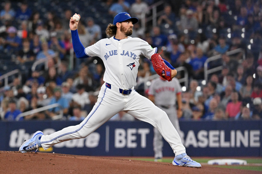 Toronto Blue Jays starting pitcher Kevin Gausman (34) throws to a Boston Red Sox batter in first inning American League baseball action in Toronto on Tuesday, Sept. 23, 2025. (Jon Blacker/The Canadian Press via AP)