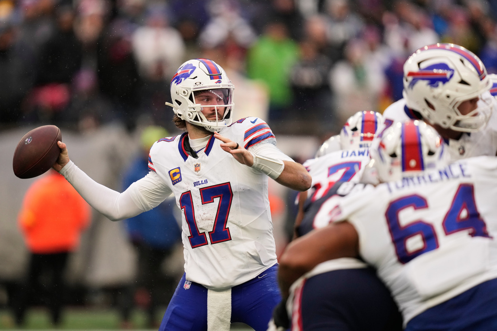 Buffalo Bills quarterback Josh Allen (17) passes against the New England Patriots during the second half of an NFL football game in Foxborough, Mass., Sunday, Dec. 14, 2025. (AP Photo/Charles Krupa)