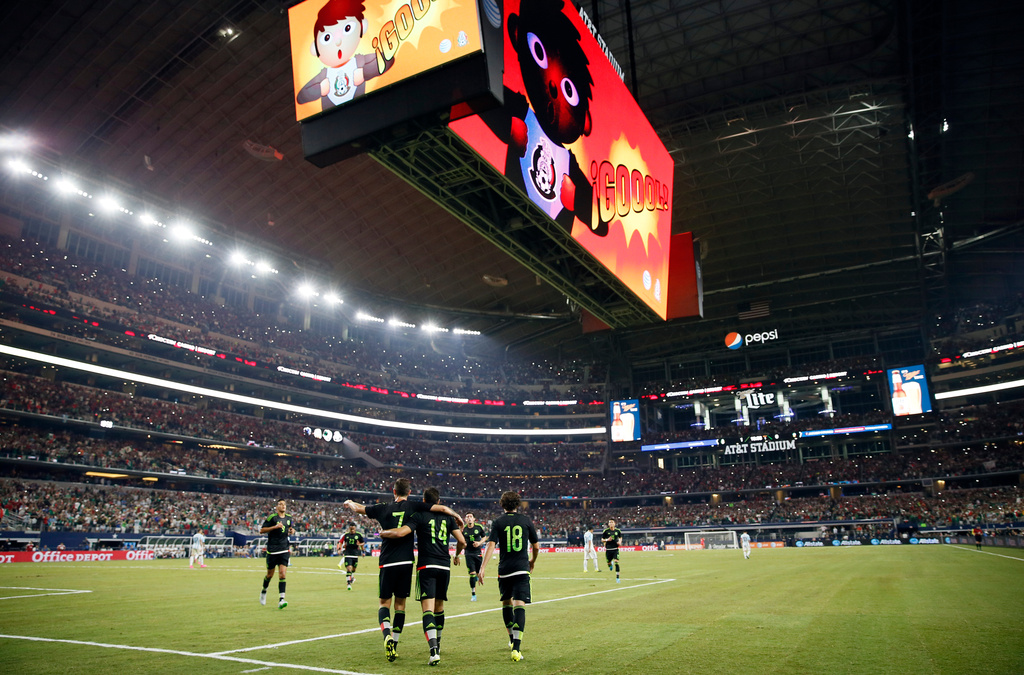 FILE - Mexico's Javier Hernandez (14) celebrates with teammates after scoring a penalty kick during a friendly soccer match against Argentina at the AT&T Stadium in Arlington, Texas, Sept. 8, 2015. (AP Photo/Tony Gutierrez, File)