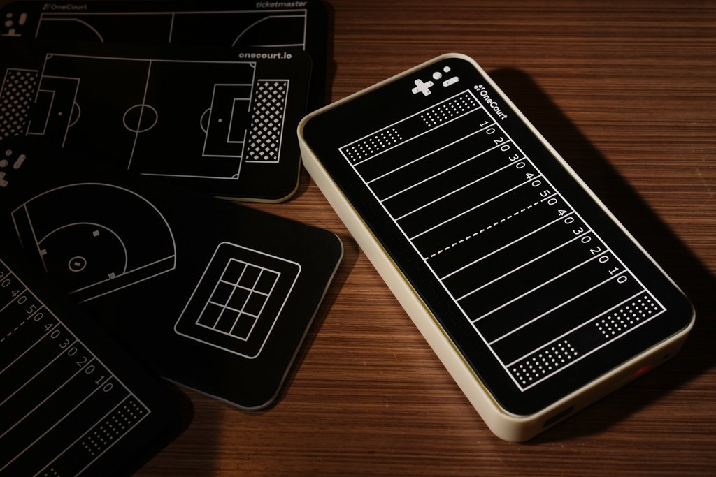 A OneCourt tablet, a tactile device that translates gameplay into trackable vibrations along with real-time audio, is pictured at the T-Mobile Innovation Hub Tuesday, Jan. 27, 2026, in Bellevue, Wash. (AP Photo/Lindsey Wasson)