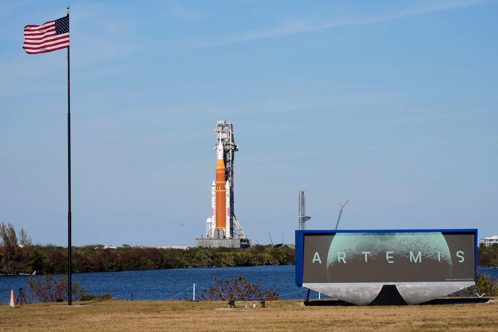 NASA's Artemis II SLS (Space Launch System) moon rocket with the Orion spacecraft slowly rolls back towards the Vehicle Assembly Building at the Kennedy Space Center, Wednesday, Feb. 25, 2026, in Cape Canaveral, Fla. (AP Photo/John Raoux)