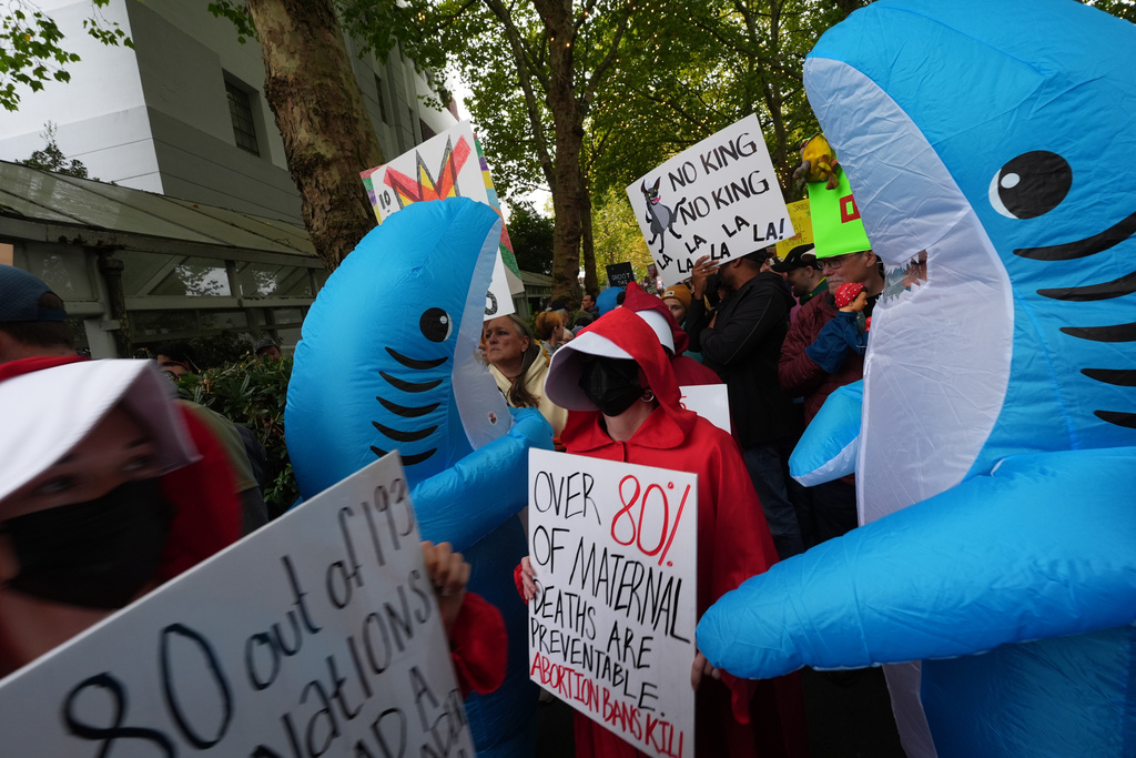People take part in a "No Kings" protest Saturday, Oct. 18, 2025, in Seattle. (AP Photo/Lindsey Wasson)