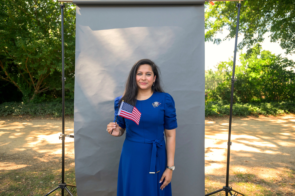 New U.S. citizen Anita Nawshin, from Bangladesh, poses for a portrait following a naturalization ceremony on Independence Day at George Washington's Mount Vernon, Saturday, July 4, 2026, in Alexandria, Va. (AP Photo/Rod Lamkey, Jr.)