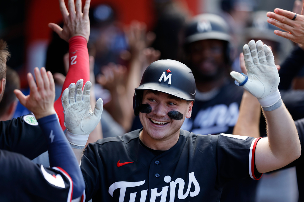 Minnesota Twins' Alan Roden is greeted by teammates after hitting a three-run home run during the seventh inning of a baseball game against the Los Angeles Angels, Sunday, Sept. 20, 2026, in Anaheim, Calif. (AP Photo/Caroline Brehman)