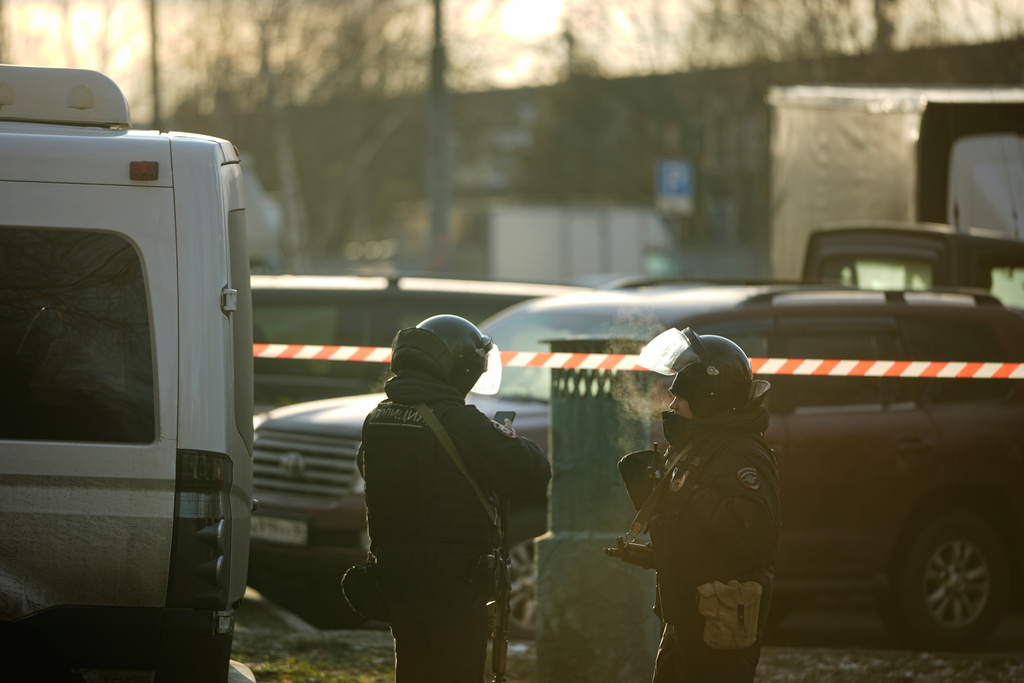 Police block the road near the scene of a deadly explosion in Moscow, Wednesday, Dec. 24, 2025. (AP Photo/Pavel Bednyakov)