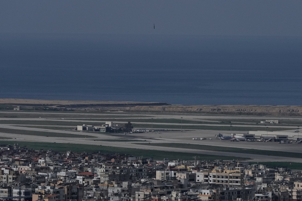 A bomb dropped from an Israeli jet falls before hitting a building in Dahiyeh, southern suburb of Beirut, near Rafik Hariri International Airport, Lebanon, Wednesday, March 4, 2026. (AP Photo/Bilal Hussein)