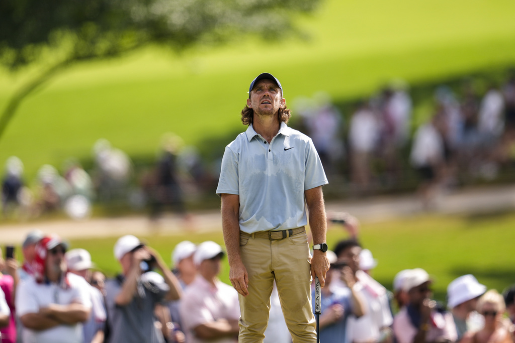 Tommy Fleetwood, of England, reacts to his putt on the 11th green during the final round of the Tour Championship golf tournament, Sunday, Aug. 24, 2025, in Atlanta. (AP Photo/Mike Stewart)