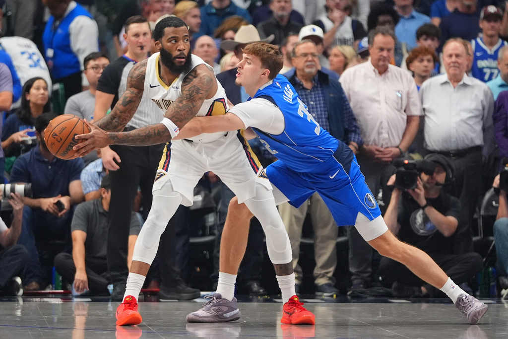 New Orleans Pelicans guard Saddiq Bey, left, keeps the ball from Dallas Mavericks forward Cooper Flagg (32) during the first half of an NBA basketball game in Dallas, Wednesday, Nov. 5, 2025. (AP Photo/LM Otero)