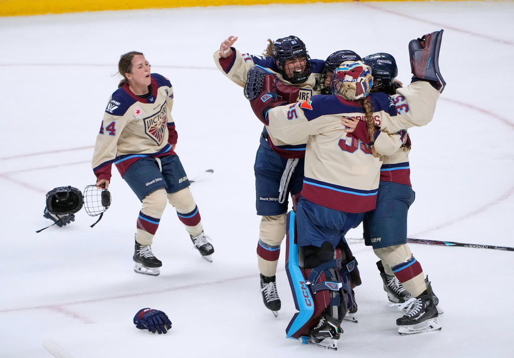 Montreal Victoire players celebrate after defeating the Ottawa Charge to win the PWHL Walter Cup hockey final in Ottawa, Wednesday May 20, 2026. (Adrian Wyld/The Canadian Press via AP)