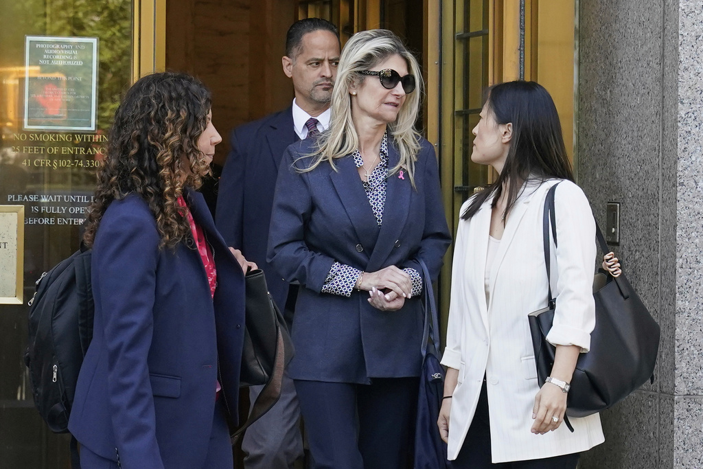 Nadine Menendez, wife of former U.S. Sen. Bob Menendez, center, accompanied by her lawyer Sarah Krissoff, left, leaves a Manhattan federal court in New York, Thursday, Sept. 11, 2025. (AP Photo/Richard Drew)