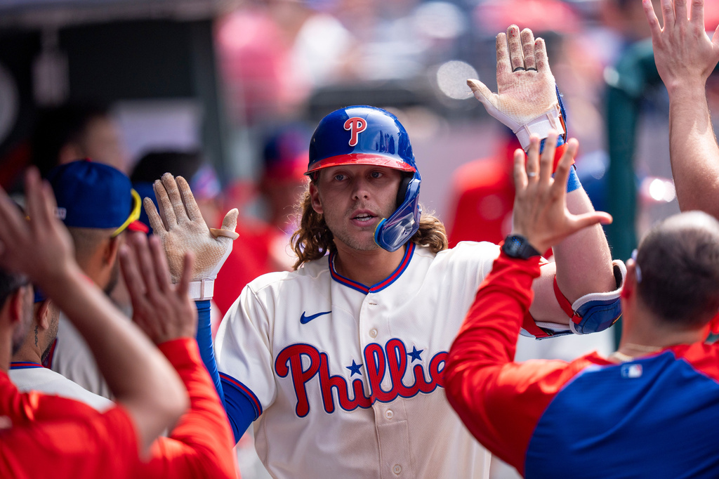 Philadelphia Phillies' Alec Bohm celebrates with teammates after hitting a home run during the seventh inning of a baseball game against the New York Mets, Sunday, July 19, 2026, in Philadelphia. (AP Photo/Chris Szagola)