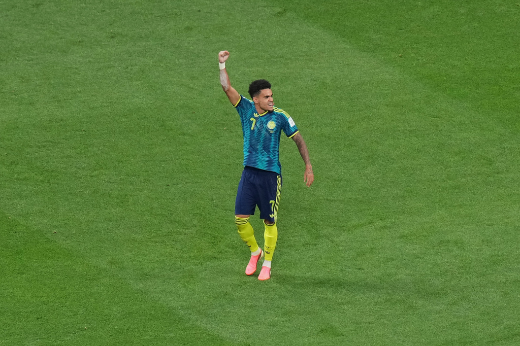 Colombia's Luis Diaz (7) celebrates after scoring his side's second goal during the World Cup Group K soccer match between Uzbekistan and Colombia in Mexico City, Wednesday, June 17, 2026. (AP Photo/Silvia Izquierdo)