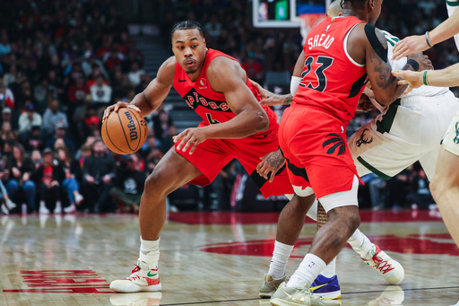 Toronto Raptors' Scottie Barnes (4) moves around a block by teammate Jamal Shead (23) during first-half NBA basketball game action against the Milwaukee Bucks in Toronto, Friday, Oct. 24, 2025. (Nick Iwanyshyn/The Canadian Press via AP) Toronto Raptors' Scottie Barnes (4) moves around a block by teammate Jamal Shead (23) during first-half NBA basketball game action against the Milwaukee Bucks in Toronto, Friday, Oct. 24, 2025. (Nick Iwanyshyn/The Canadian Press via AP)