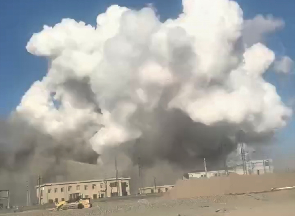 In this photo released by Xinhua News Agency, smoke rises from the site of explosions from a factory in Baotou, in north China's Inner Mongolia Autonomous Region, Sunday, Jan. 18, 2026. (Xinhua via AP)