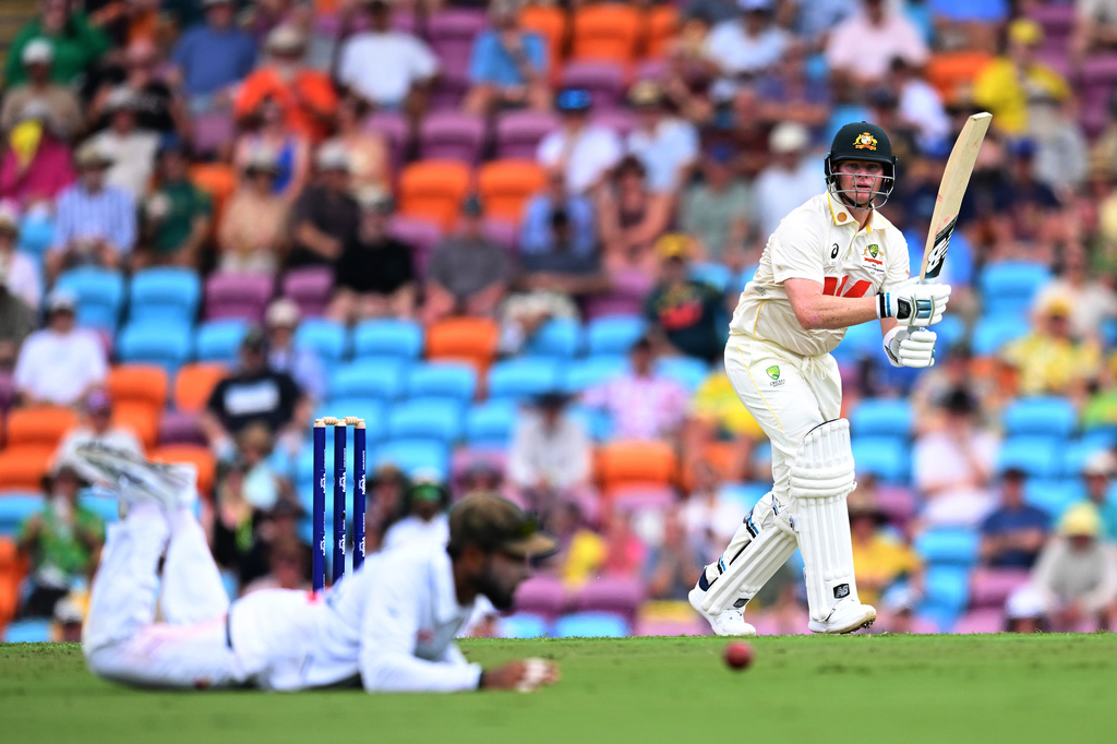 Australia's Steve Smith, right, watches the ball after playing a shot against Bangladesh during their cricket test match in Darwin, Australia, Thursday, Aug. 13, 2026. (James Ross/AAP Image via AP)