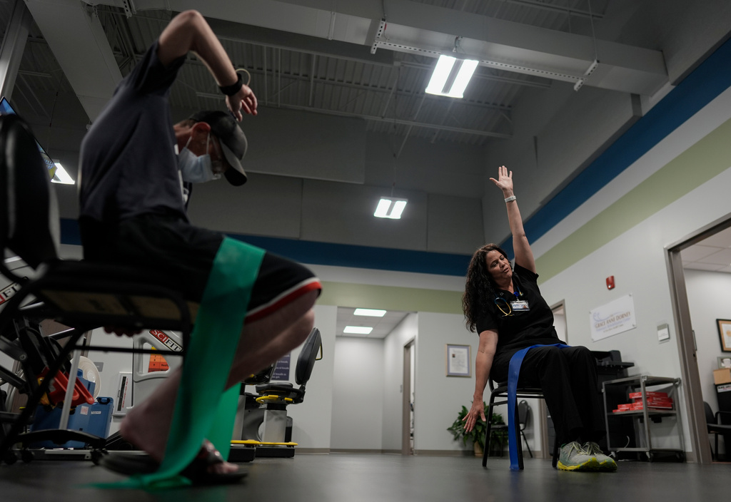 Lisa Emery, director of the New River Health Association Black Lung Clinic, right, works with a patient with black lung disease, Sept. 23, 2025, in Oak Hill, W.Va. (AP Photo/Carolyn Kaster)