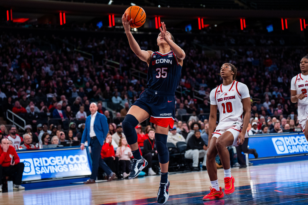 UConn guard Azzi Fudd (35) shoots a two-pointer during the first half of an NCAA college basketball game against St. John's, Sunday, March 1, 2026, in New York. (AP Photo/Angelina Katsanis)