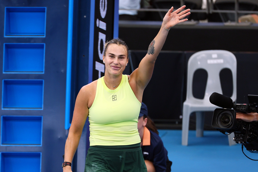 Aryna Sabalenka, of Belarus, waves at the crowd after she won her semifinal match against Karolína Muchova, of the Czech Republic, at the Brisbane International tennis tournament in Brisbane, Australia, Saturday, Jan. 10, 2026. (AP Photo/Tertius Pickard)