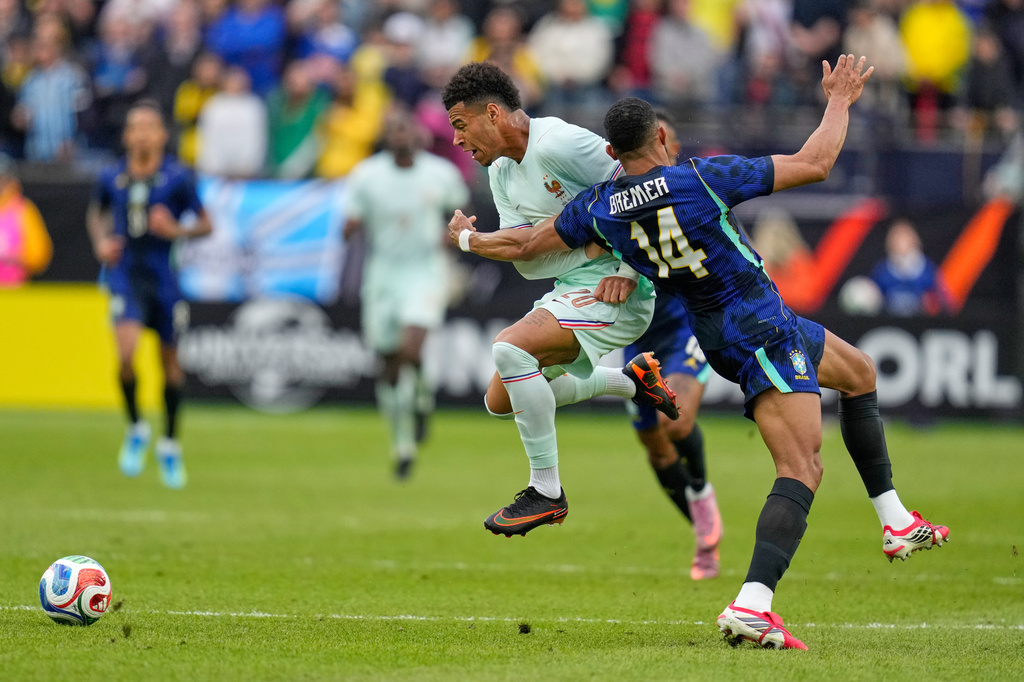 Desire Doue of France is fouled by Brazil's Bremer, right, during the international friendly soccer match between Brazil and France in Foxborough, Mass, Thursday, March 26, 2026. (AP Photo/Charles Krupa)