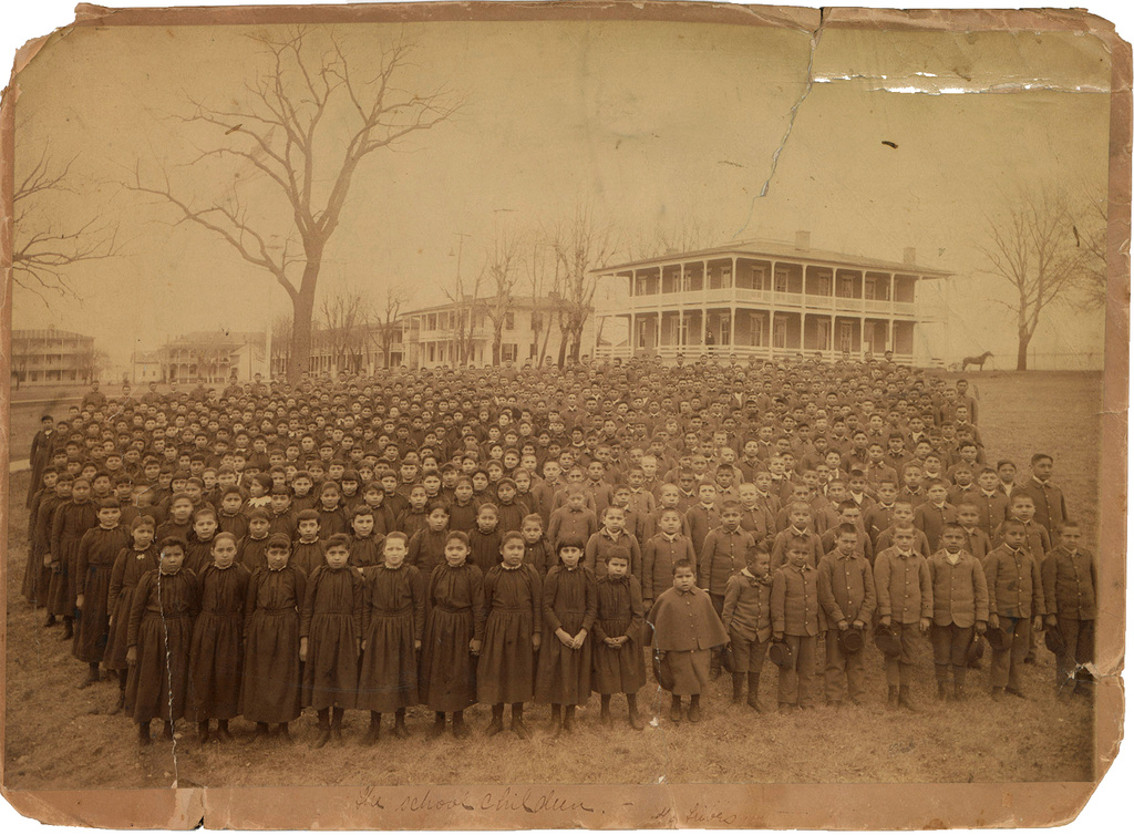 This photo provided by the Carlisle Indian School Digital Resource Center shows the 1892 student body of the Carlisle Indian Industrial School assembled on the school grounds in Carlisle, Pa. (John N. Choate via AP)