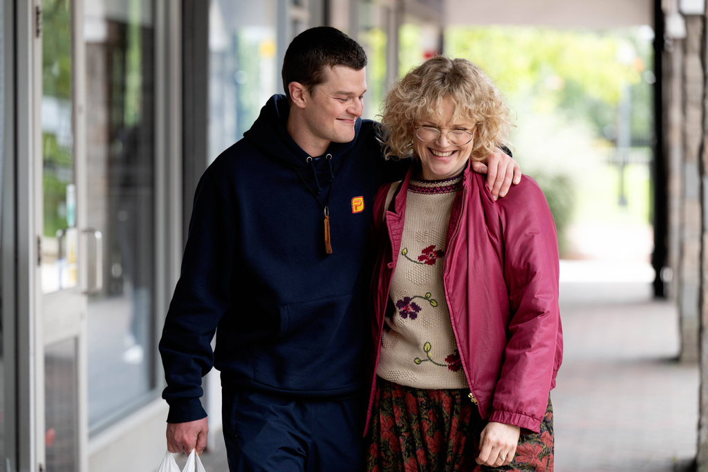 This image released by Sony Pictures Classics shows Robert Aramayo, left, and Maxine Peake in a scene from "I Swear." (Graeme Hunter/Sony Pictures Classics via AP)